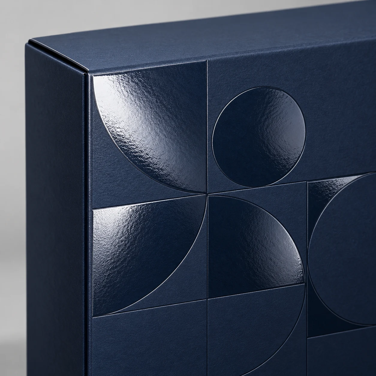 Illustrative concept of clear Spot UV gloss on a matte navy packaging box